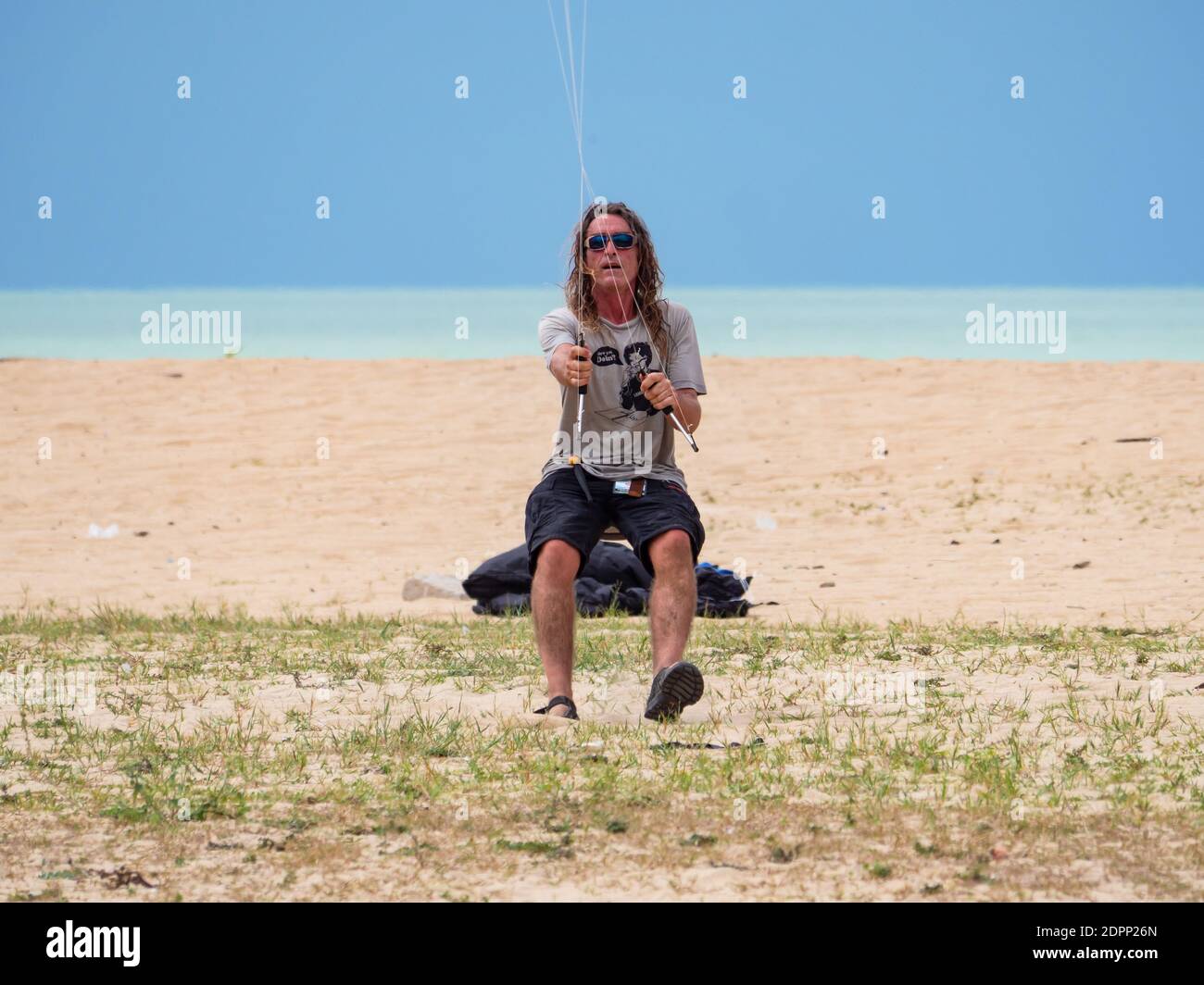 British quad kite flyer Tom Greenfield flying a stack of 8 quad kites at Kelantan International Kite Festival in Kelantan, Malaysia in August 2019. Stock Photo