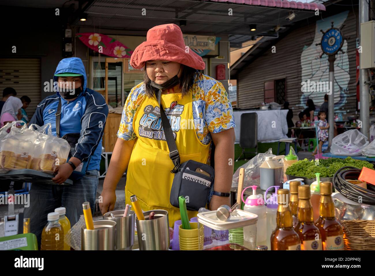 Paddington Bear hat worn by a woman being a popular funny hat fashion accessory in Thailand Southeast Asia Stock Photo