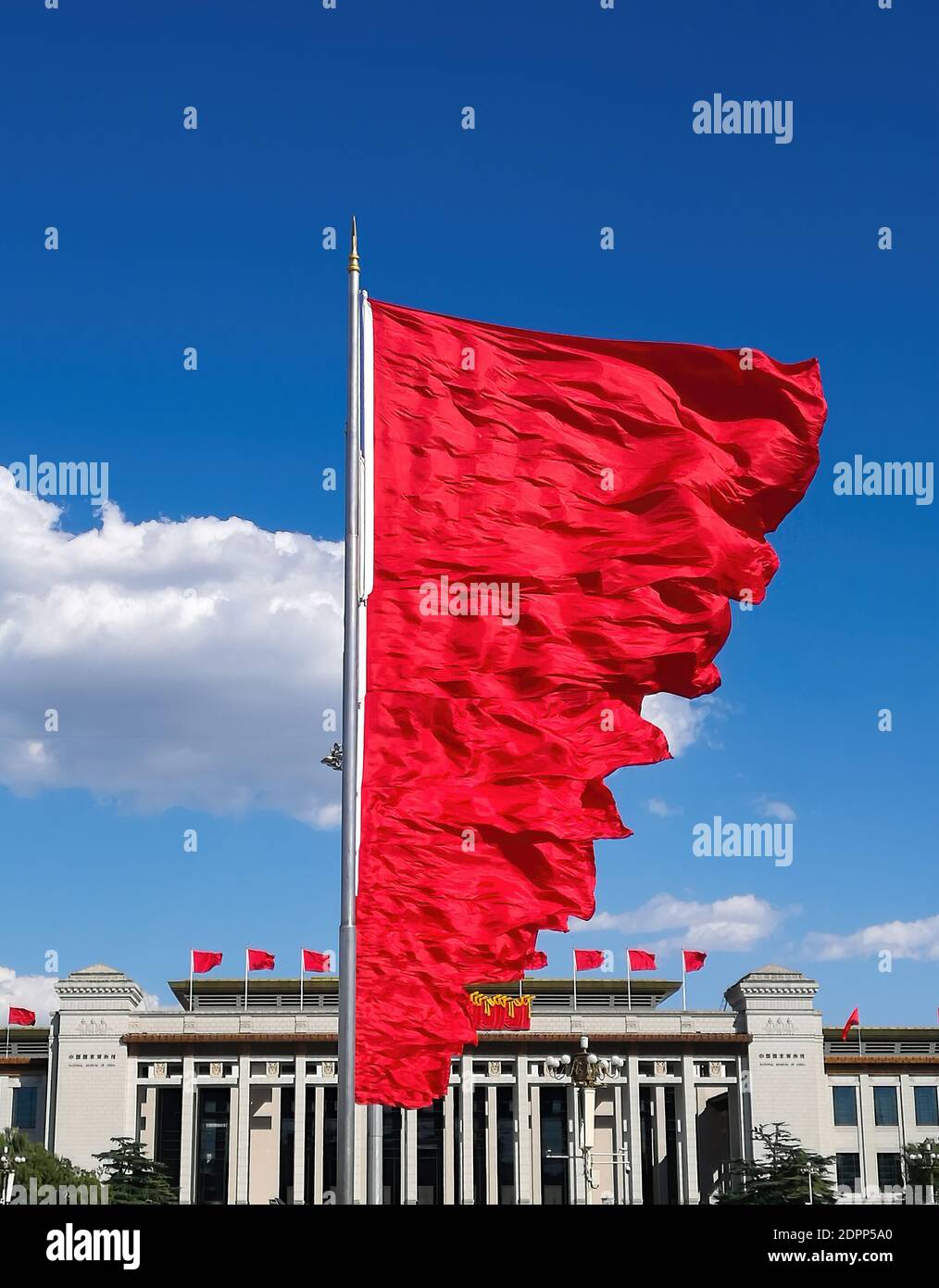 Flying red flags in Tiananmen Square, the building on the background is China national museum Stock Photo