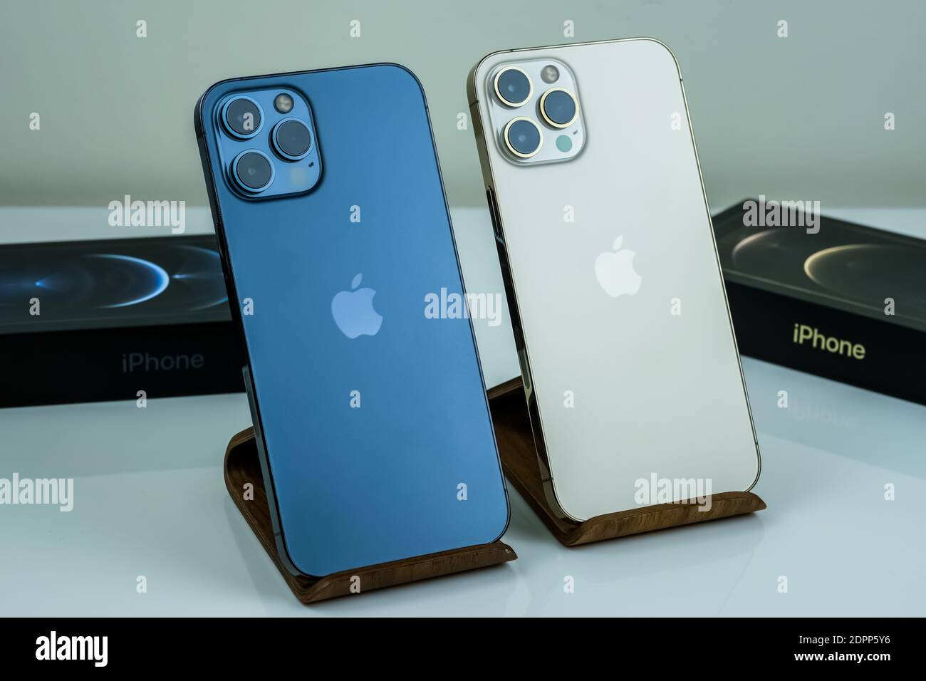 Iphone 12 Pro Max Pacific Blue Next To Iphone 12 Pro Max In Gold Stock Photo Alamy
