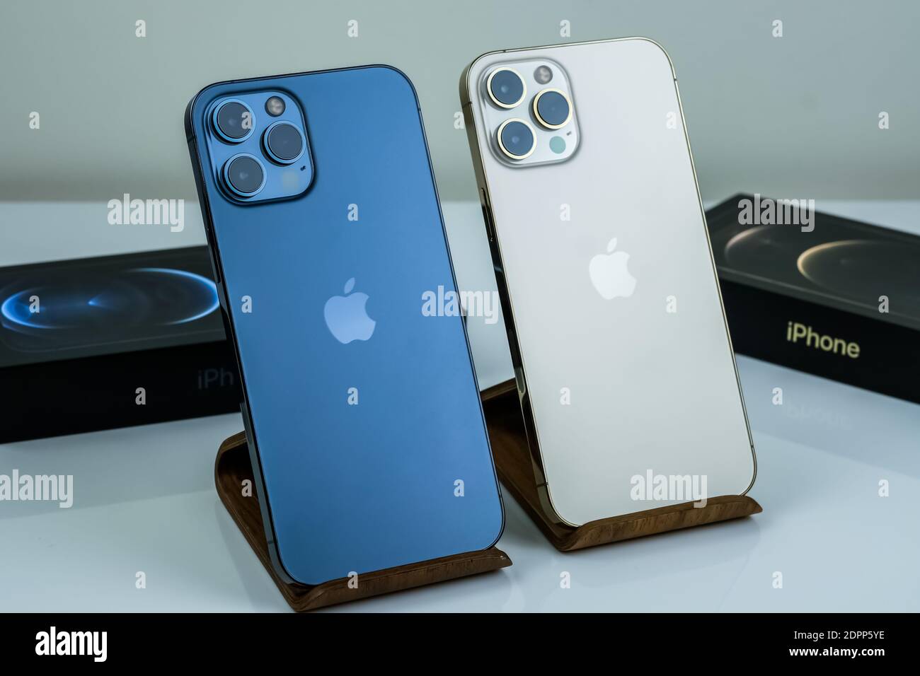 Iphone 12 Pro Max Pacific Blue Next To Iphone 12 Pro Max In Gold Stock Photo Alamy