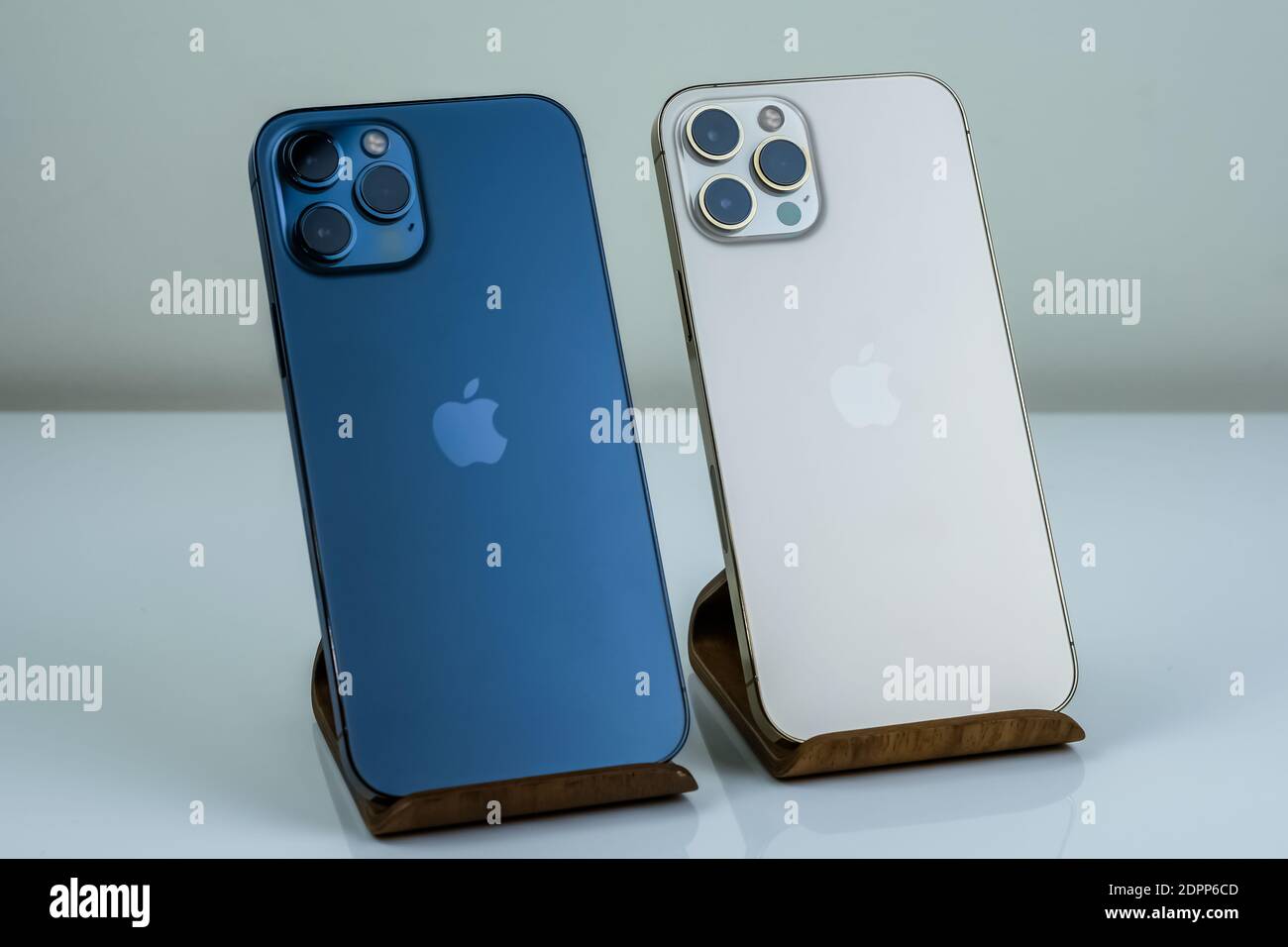 Iphone 12 Pro Max Pacific Blue Next To Iphone 12 Pro Max In Gold Stock Photo Alamy