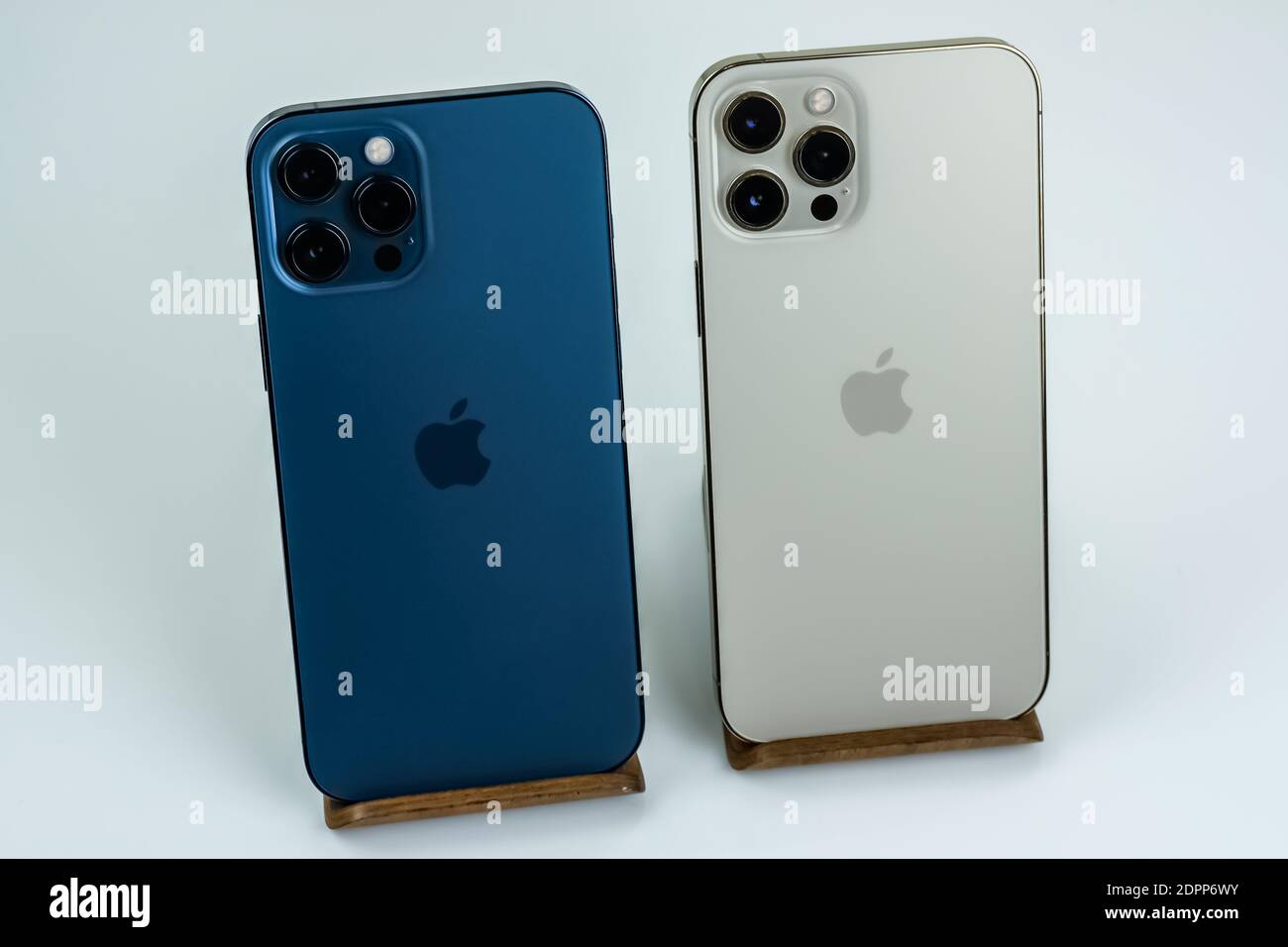 Iphone 12 Pro Max Pacific Blue Next To Iphone 12 Pro Max In Gold Stock Photo Alamy