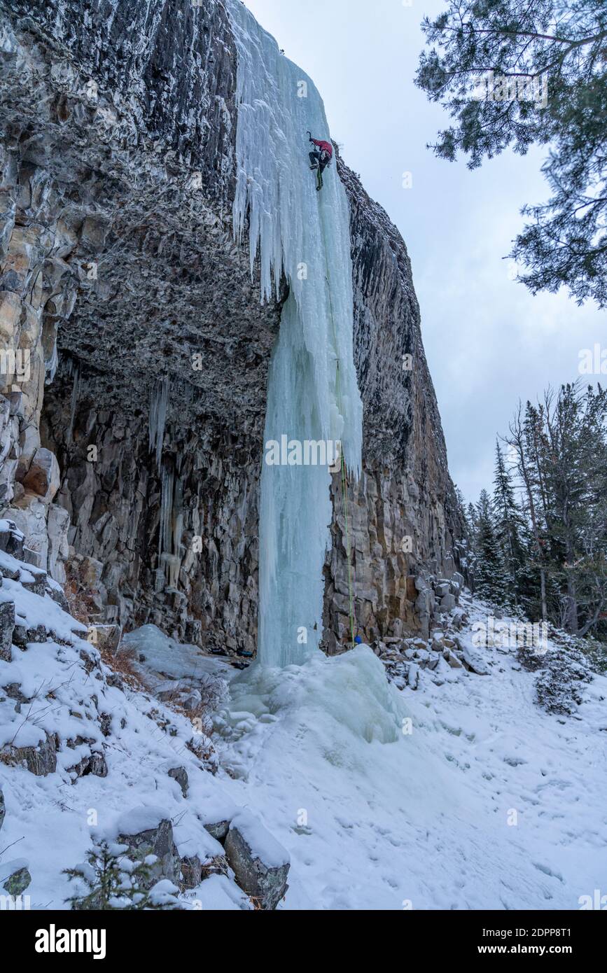 Ice climbers enjoying a day outside climbing frozen waterfalls in