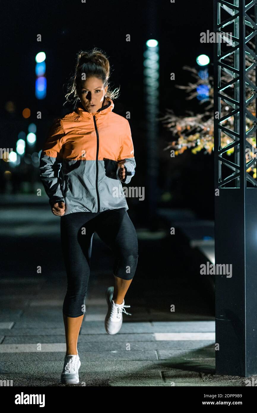 Woman Exercising Late At Night Stock Photo Alamy