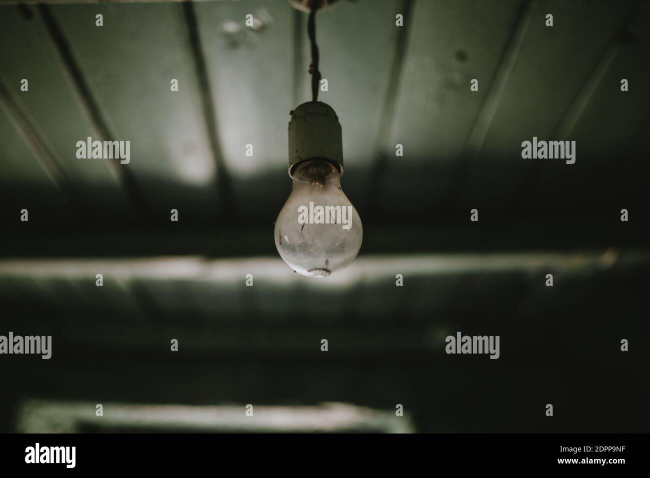Closeup Of Light Bulb Hanging From Ceiling Stock Photo Alamy