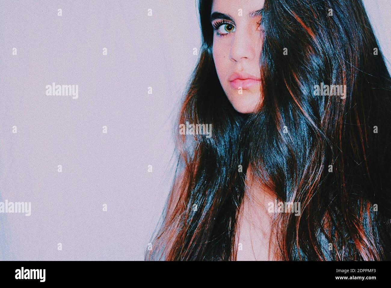 Portrait Of Beautiful Young Woman With Long Hair Stock Photo - Alamy