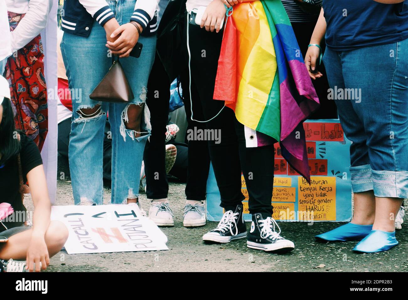 Low Section Of People With Text On Street In City Stock Photo - Alamy