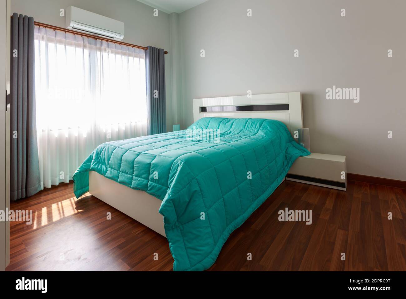 Empty Bed Against Wall At Home Stock Photo Alamy