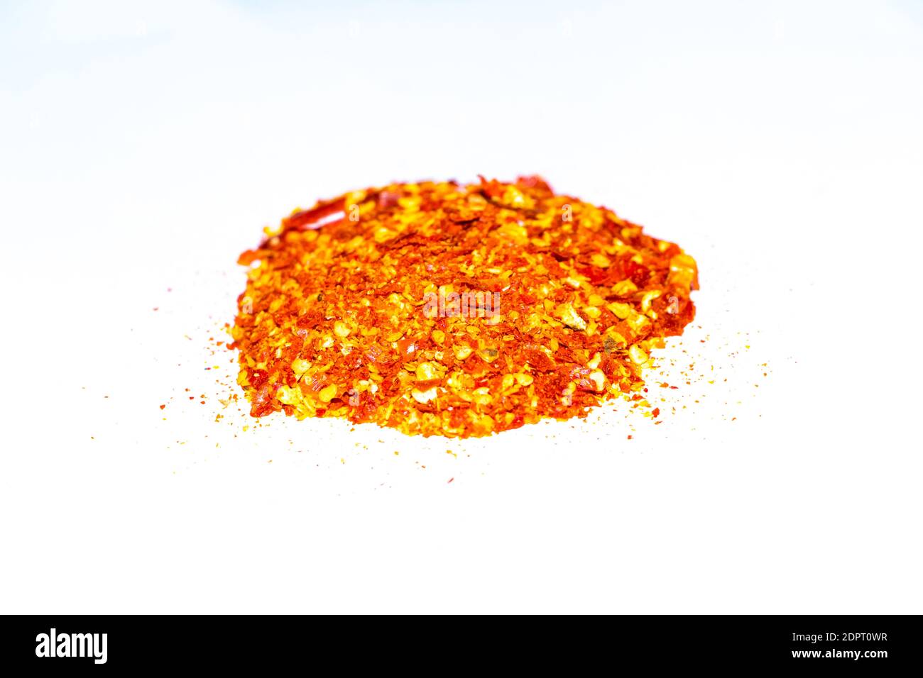 Milled Red Chilies on White Background Stock Photo - Alamy