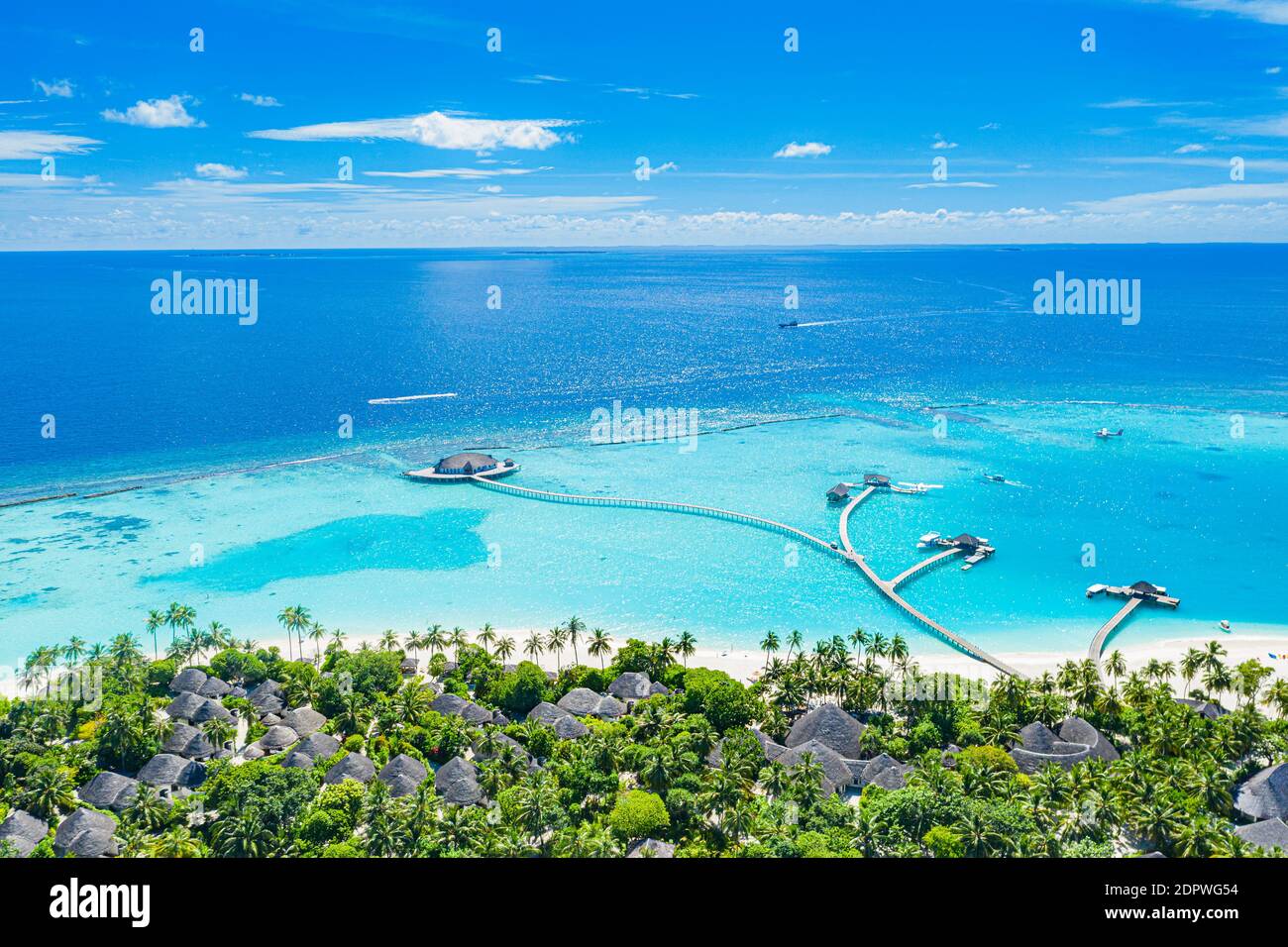 Maldives paradise scenery. Tropical aerial landscape, seascape with long jetty water villas with amazing sea and lagoon beach, tropical nature. Exotic Stock Photo