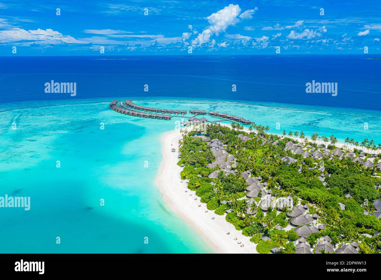 Maldives paradise scenery. Tropical aerial landscape, seascape with long jetty, water villas with amazing sea lagoon beach, tropical nature. Exotic Stock Photo