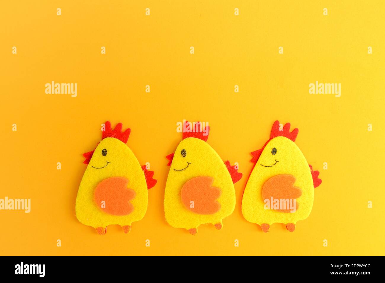 Three cute yellow felt chickens in a row, handmade, diy, kids Easter  crafts, copy space, funny handmade idea Stock Photo - Alamy