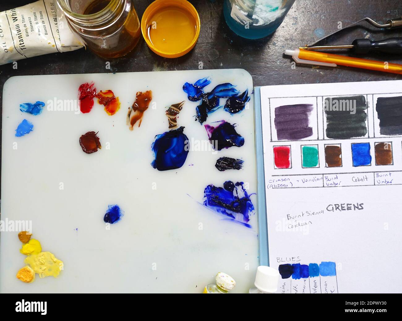 Artists paint pallete and materials Stock Photo