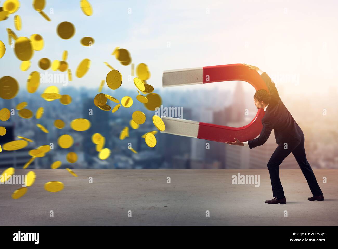 Businessman captures money with a big magnet. concept of earning success. Stock Photo
