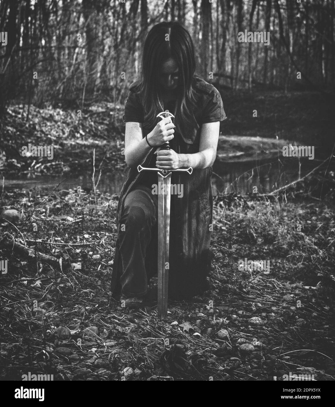 Woman kneeling outdoors Black and White Stock Photos & Images Alamy