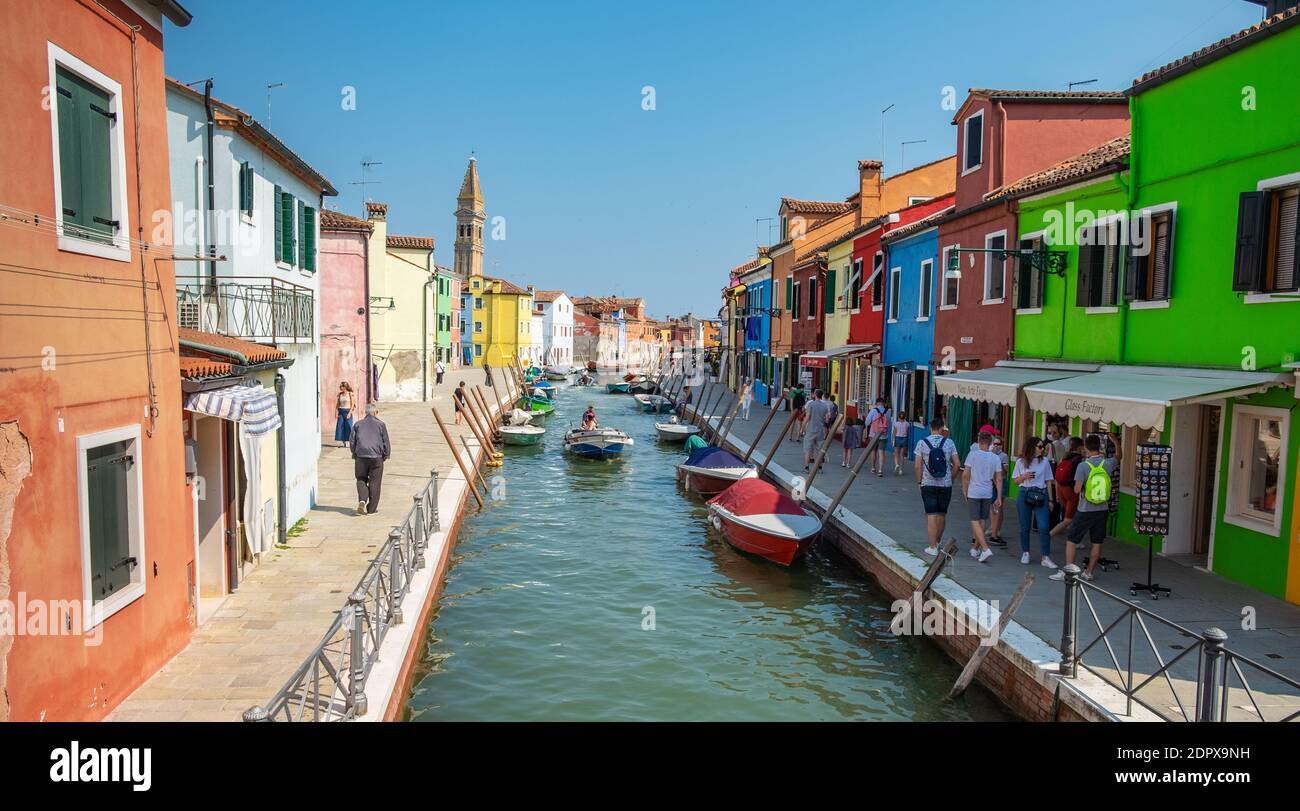 Venice landmark, Burano island canal, colorful houses and boats Stock Photo