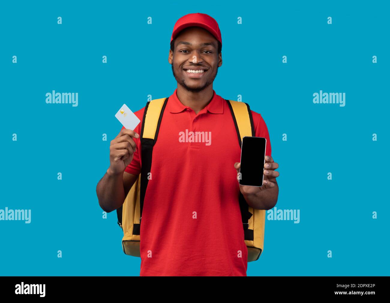 African american courier showing credit card and mobile phone Stock Photo