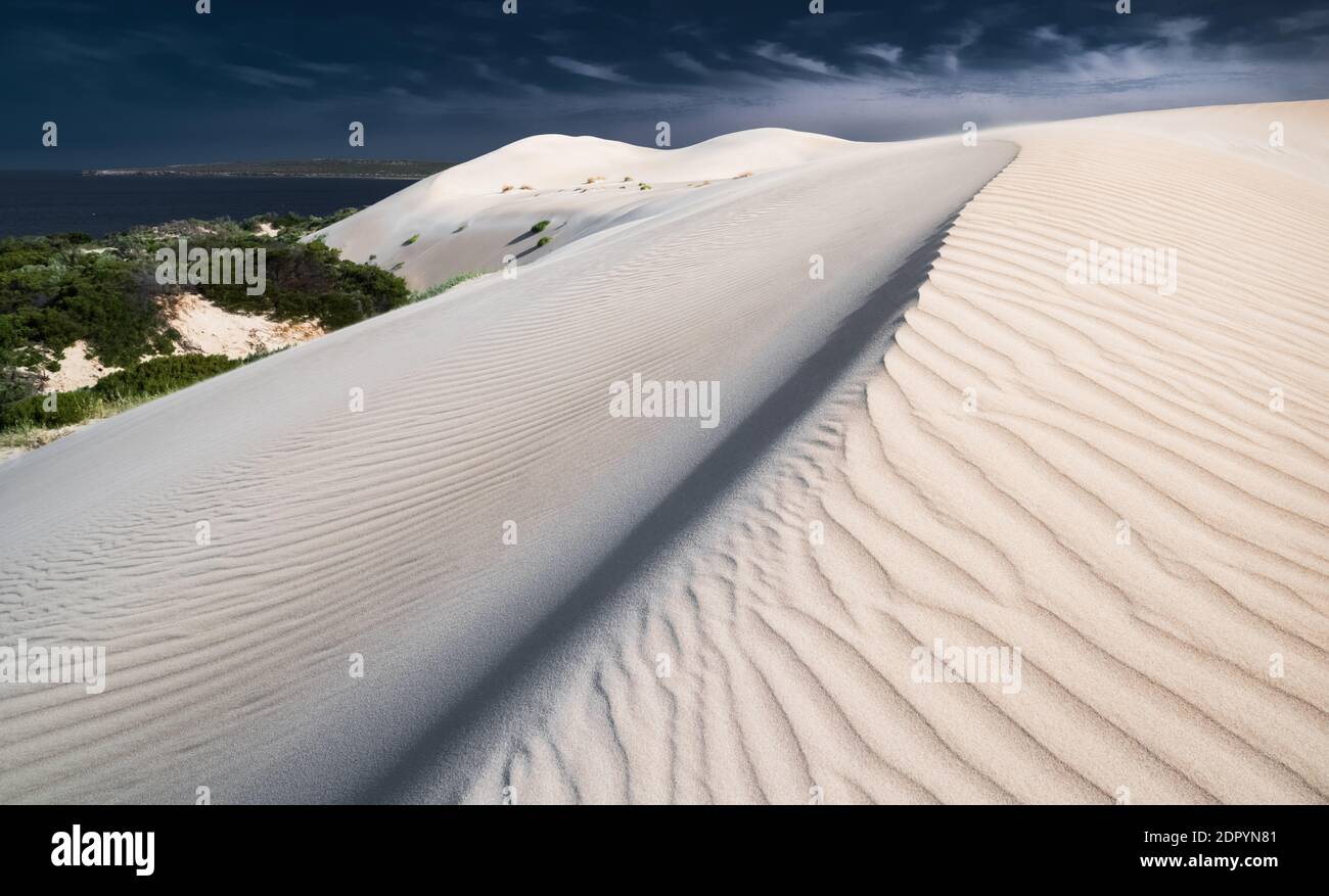 Sand Dune In Desert Against Sky Stock Photo