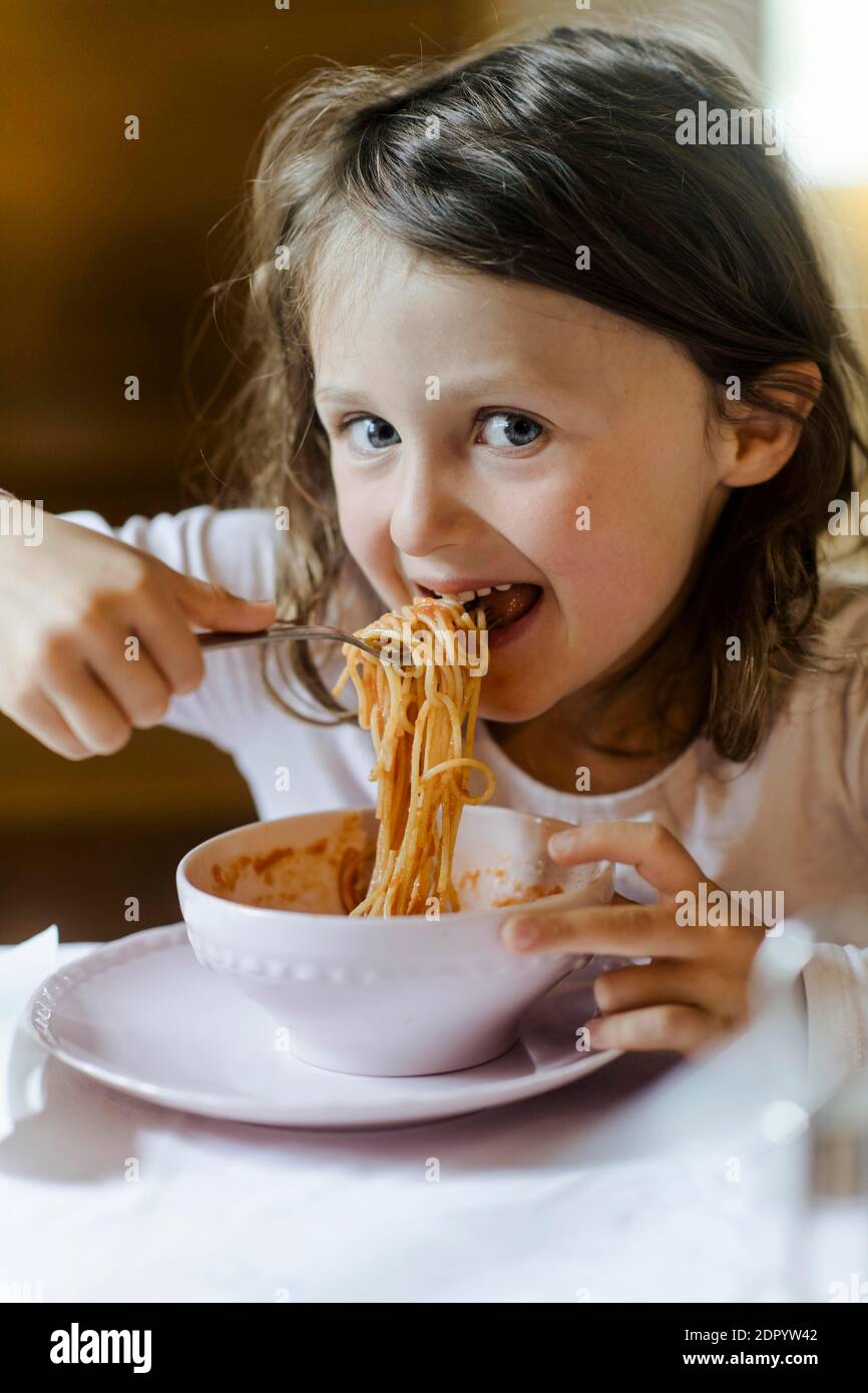 Girl eating spaghetti Stock Photo Alamy