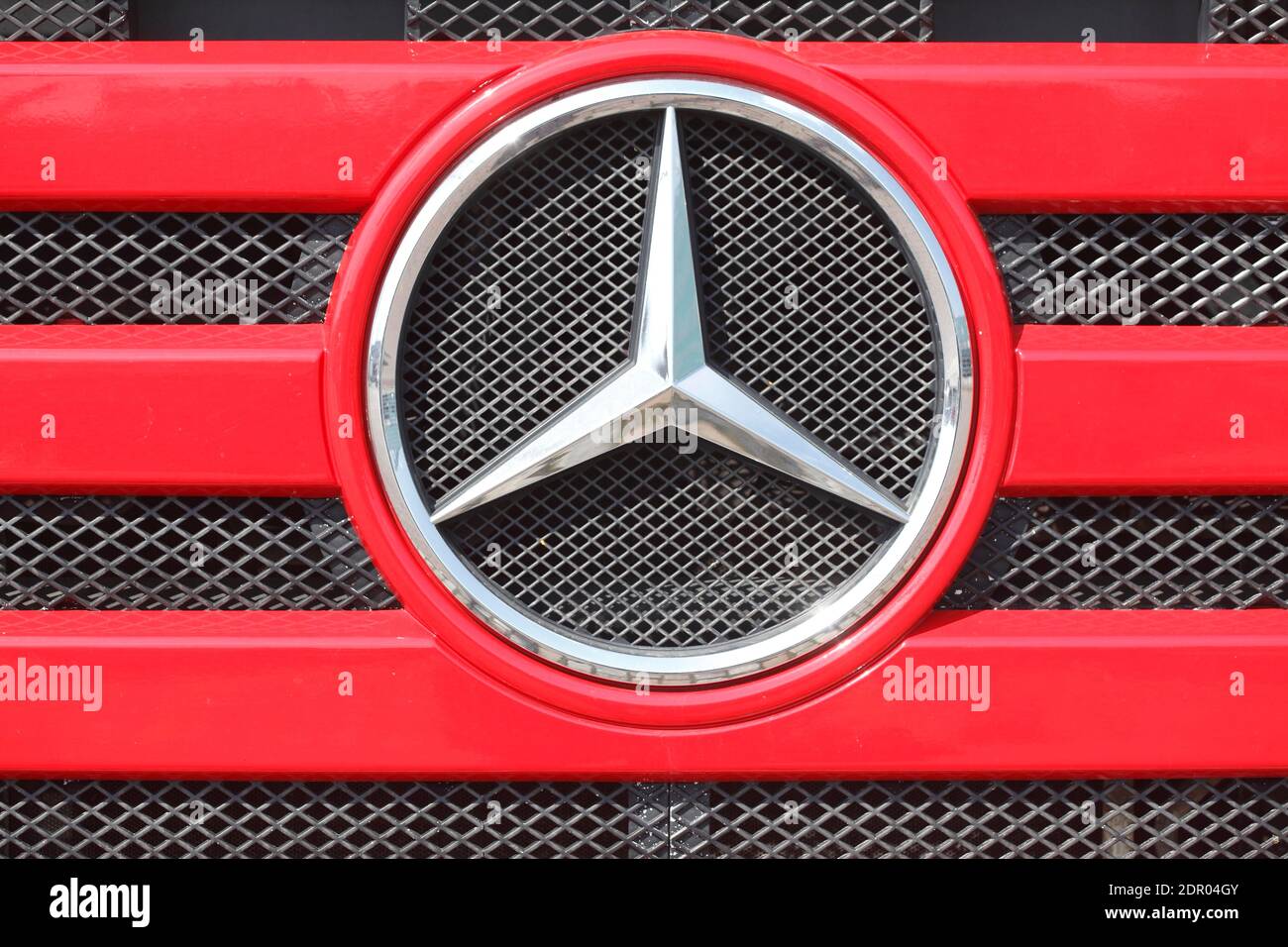 Mercedes Benz logo, Mercedes star on a red radiator grill of a truck, Germany Stock Photo
