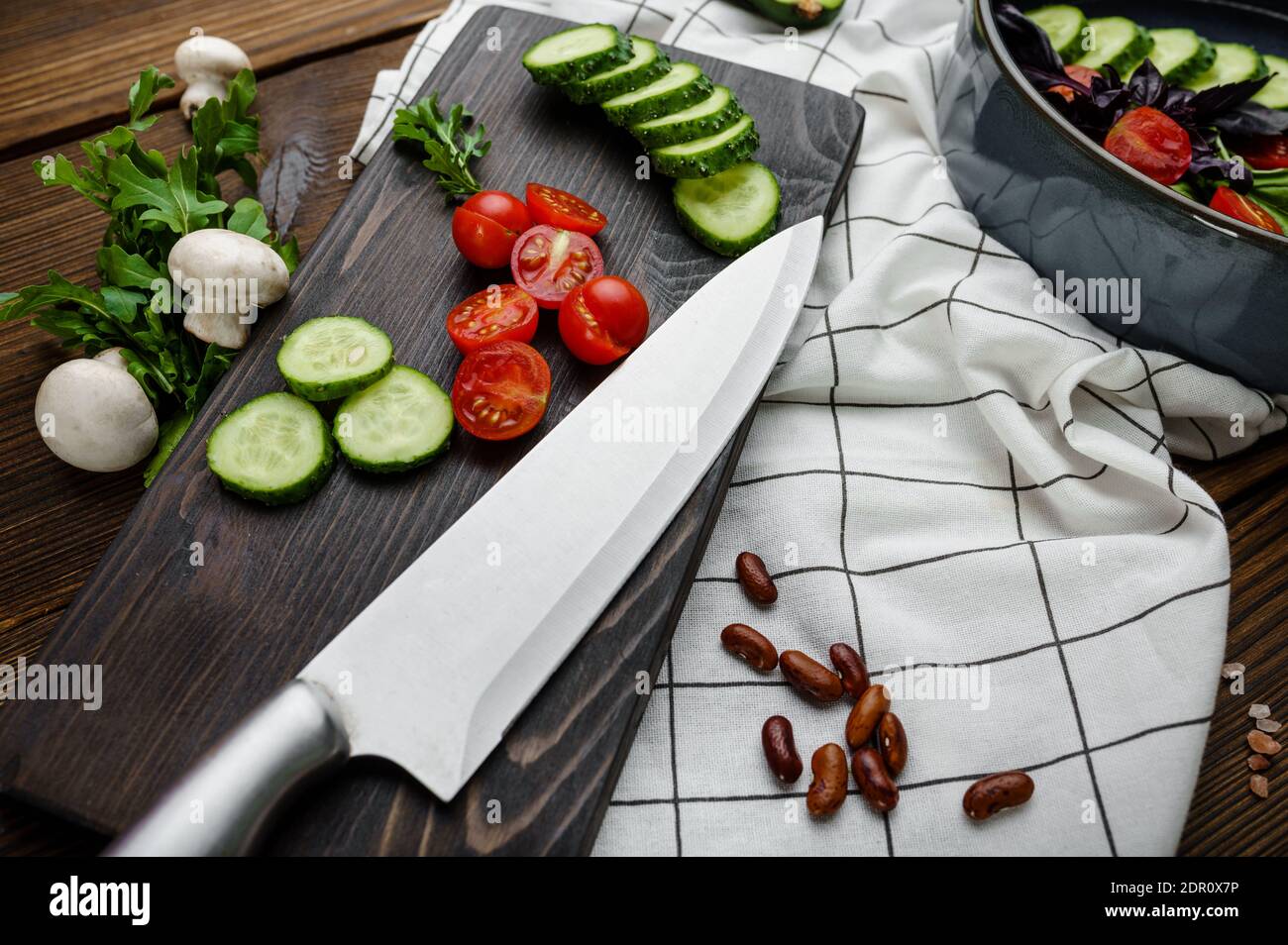 Fresh cutted vegetables, wooden background Stock Photo