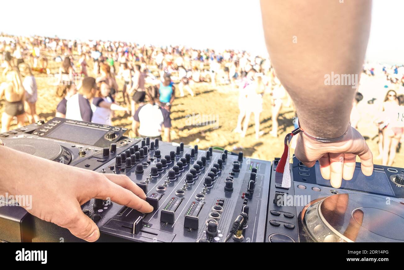 Cropped Image Of Dj Using Sound Mixer With Crowd In Background During Event  Stock Photo - Alamy