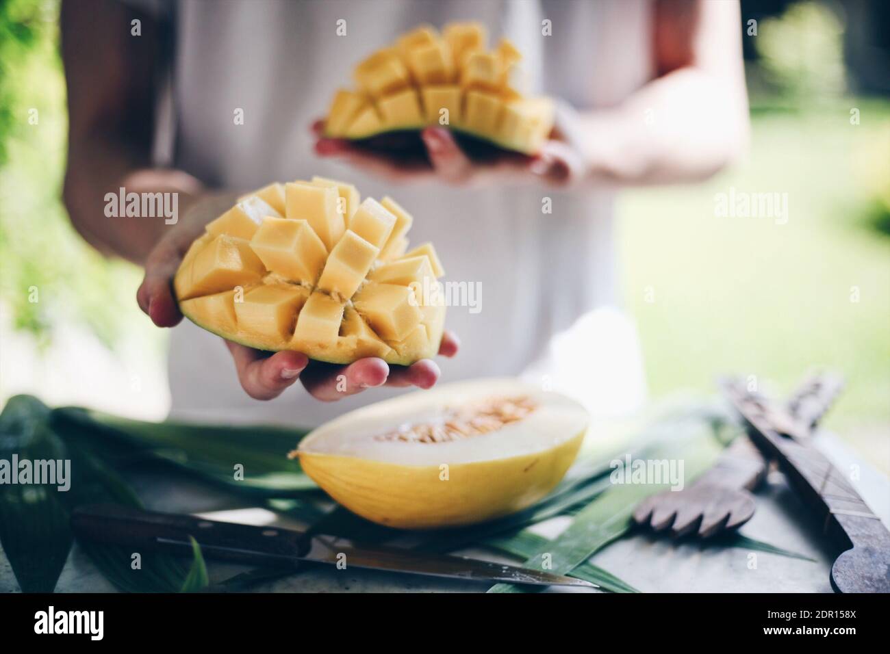 Hand man holding mango hi-res stock photography and images - Alamy