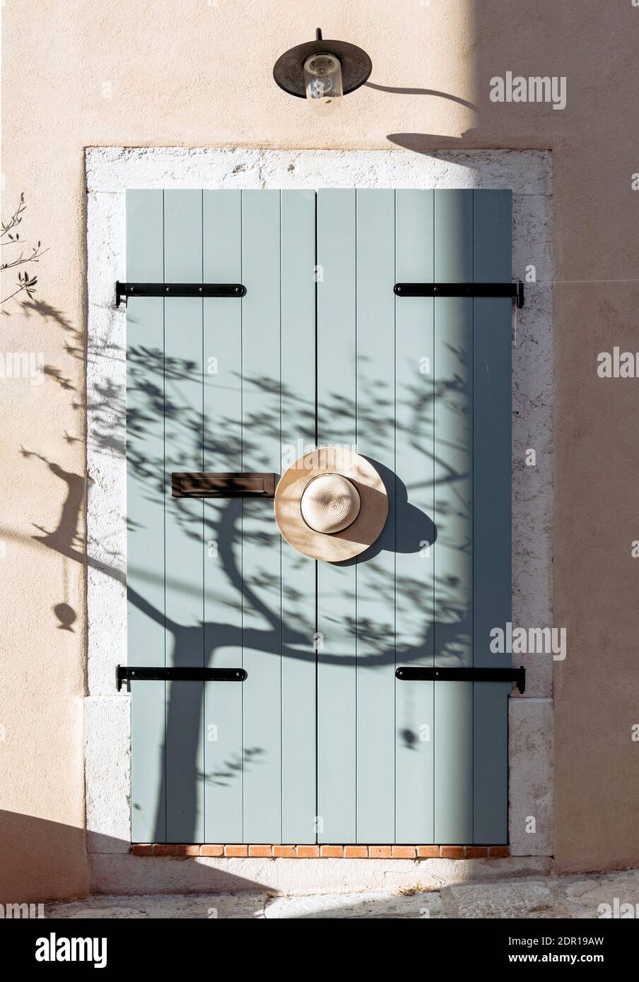 Hat Hangin On Old Wooden Door, Pastel Colored, Neutrals. Stock Photo