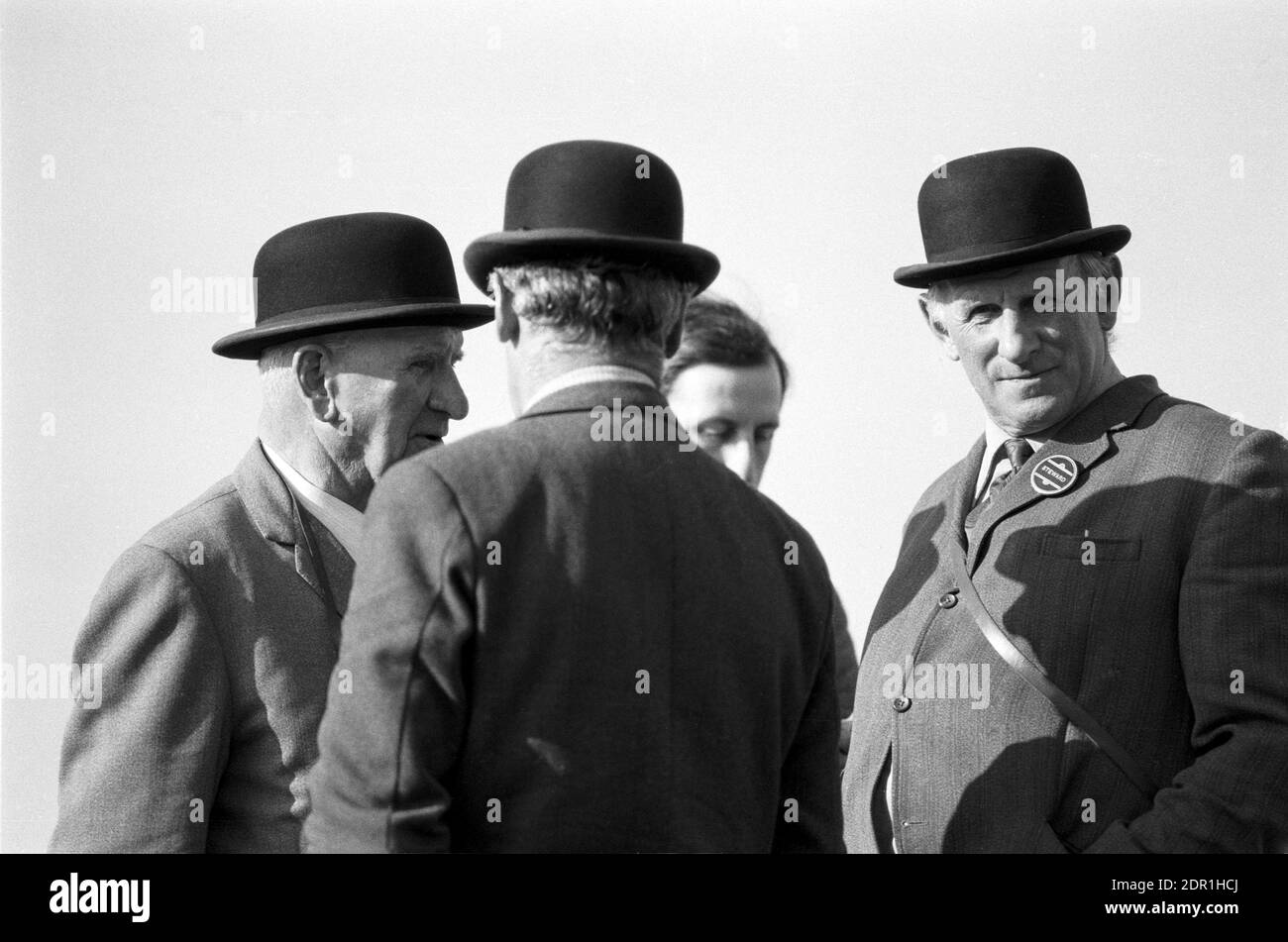 UK, England, Devonshire, Buckfastleigh, 1972. Point-to-Point horse races were held at  Dean Court on the Dean Marshes, close to the A38 between Plymouth and Exeter. Three stewards wearing black bowler hats. Stock Photo