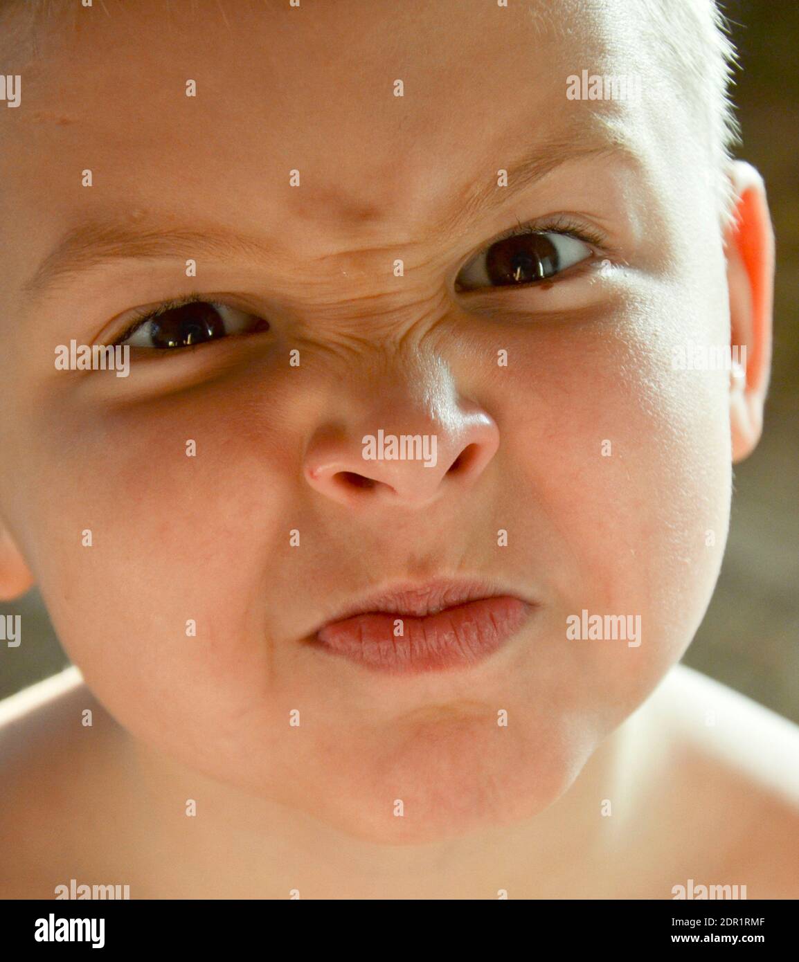 portrait of a frowning child Stock Photo