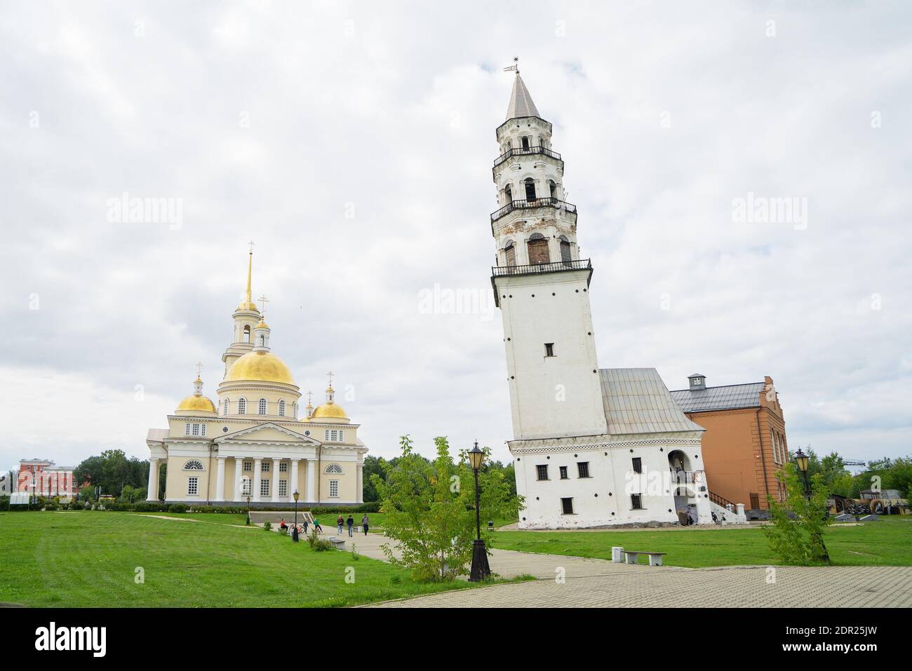 Leaning Tower of Nevyansk and Old Believers' church (domed) in summer day. Tower in the town of Nevyansk in Sverdlovsk Oblast, Russia Stock Photo