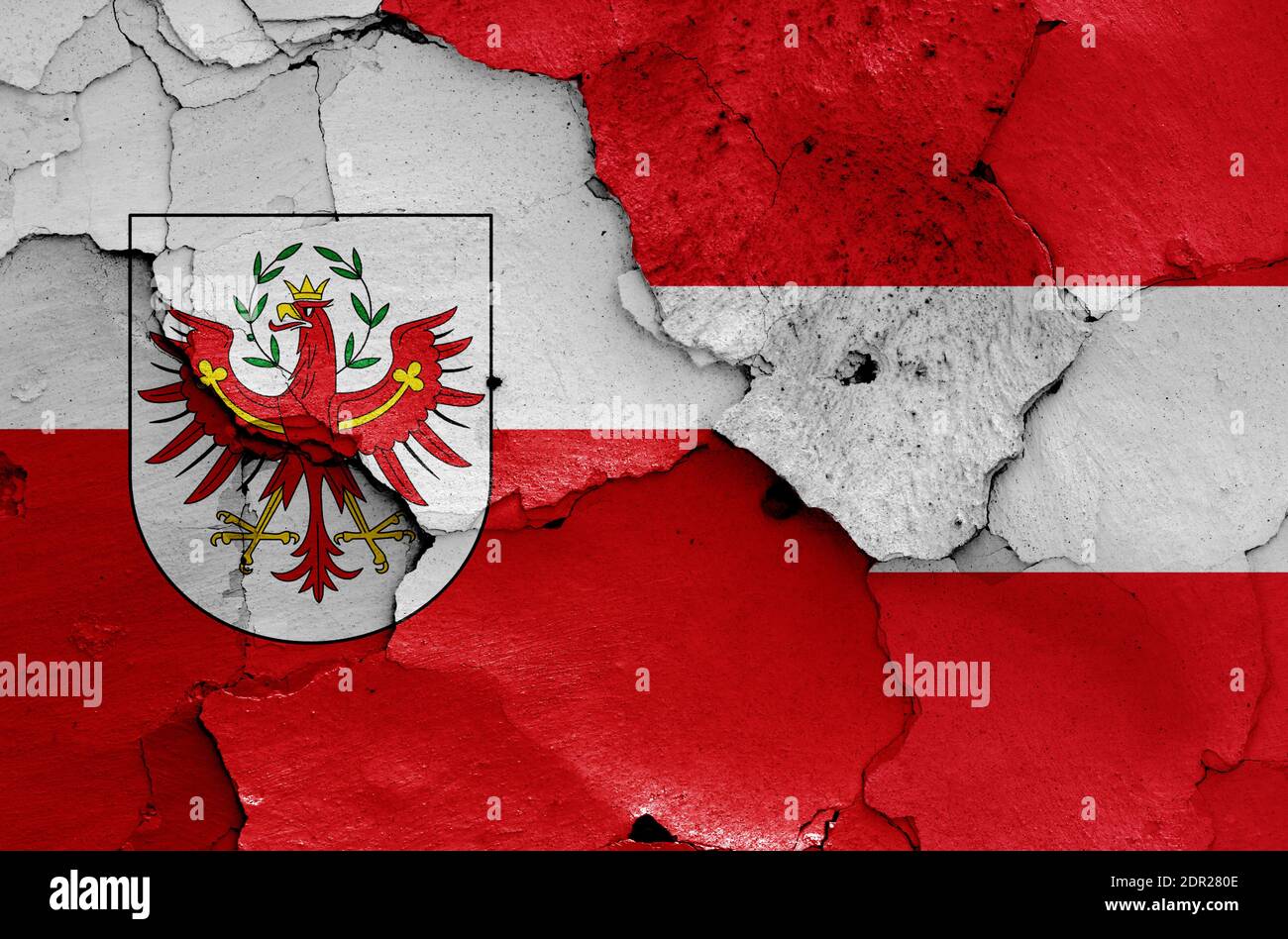 flags of Tyrol state and Austria painted on cracked wall Stock Photo