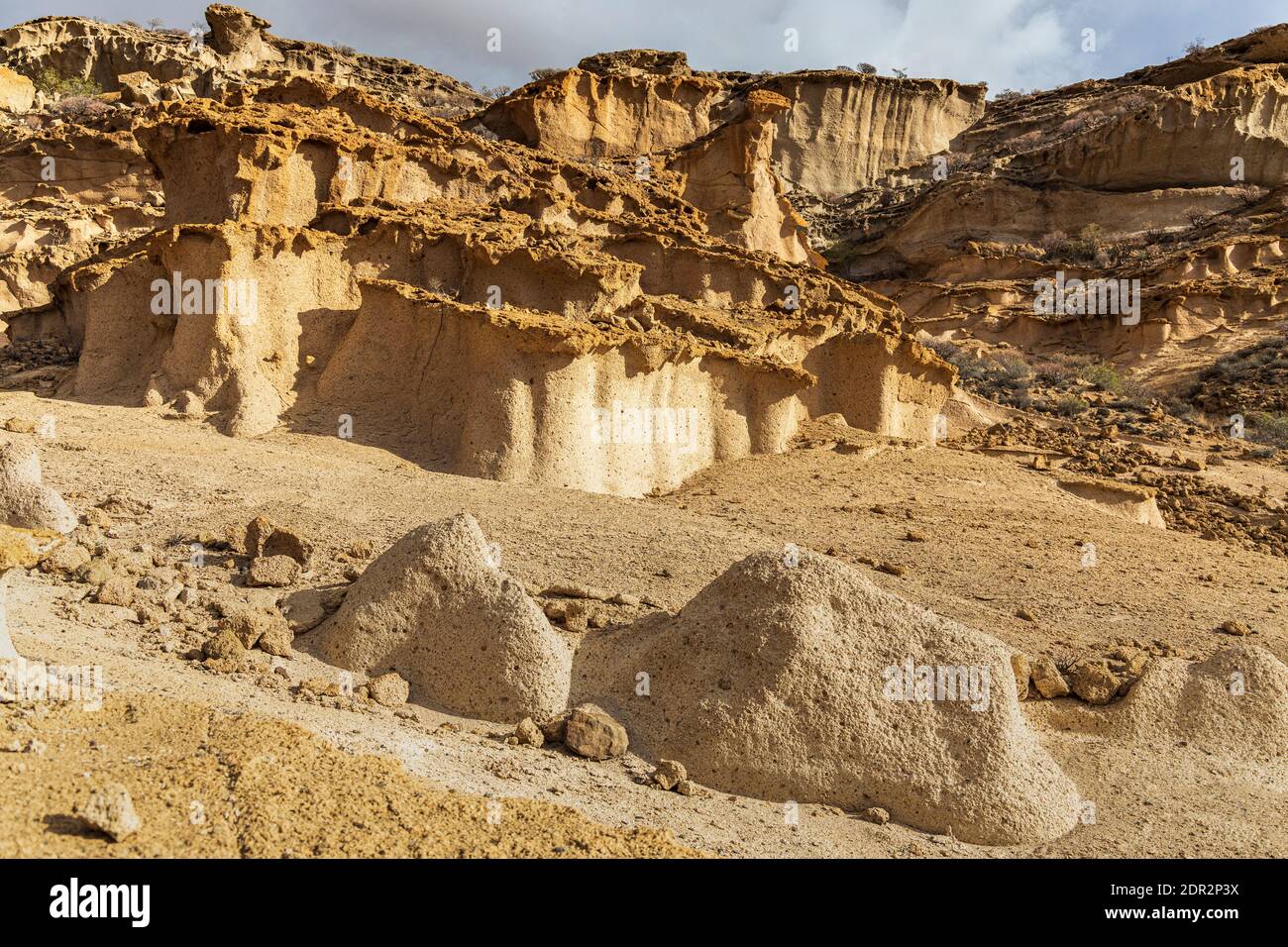 Lunar landscape, volcanic deposits eroded by wind and rain in the barranco de las monjas on a day with dramatic lighting in Granadilla, Tenerife, Cana Stock Photo