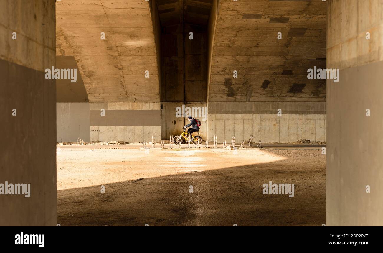naked man riding bike