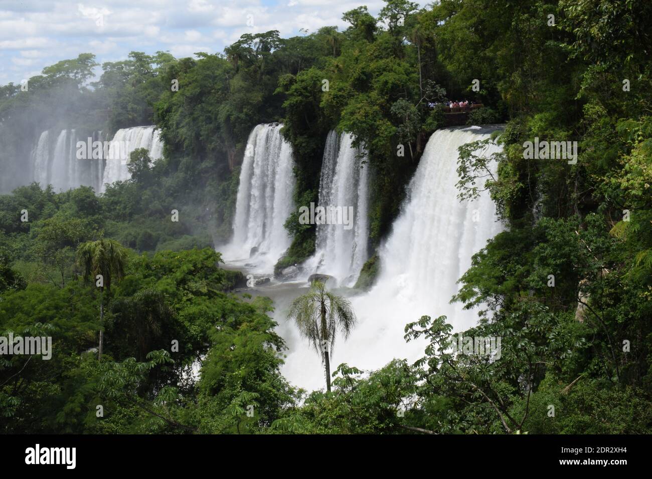 A beautiful shot of waterfalls in the forests under a bright sky Stock ...