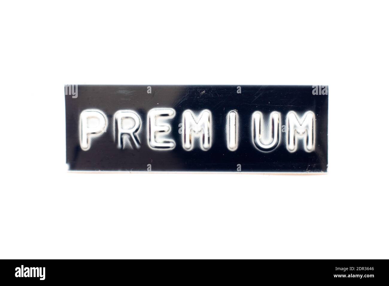 Embossed letter in word premium on black banner with white background