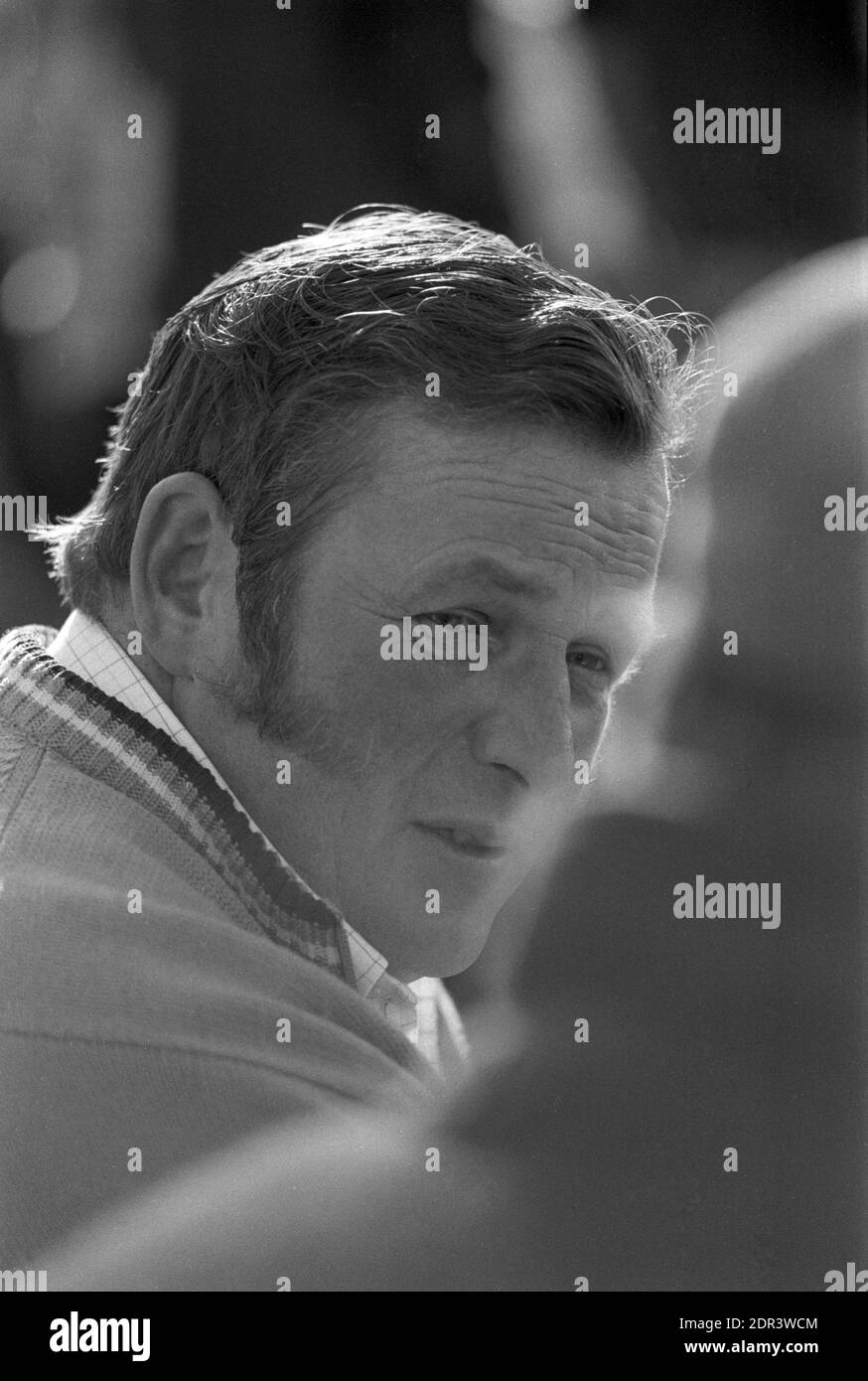 UK, England, Devonshire, Buckfastleigh, 1972. Point-to-Point races were held at  Dean Court on the Dean Marshes, close to the A38 between Plymouth and Exeter. A male spectator with fashionable sideburns. Stock Photo