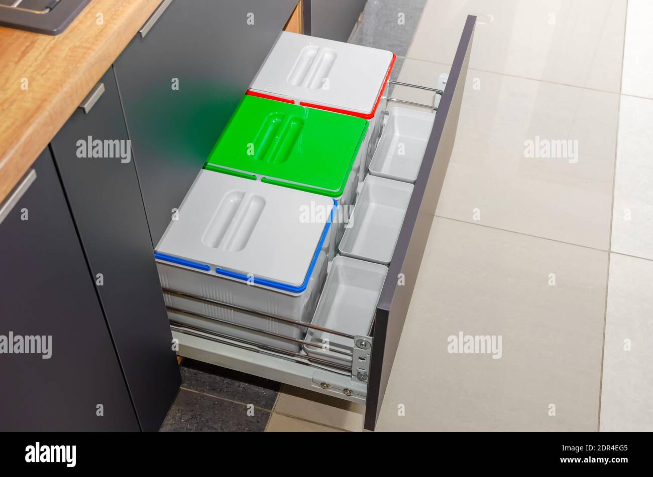 Three garbage containers for sorting garbage in the kitchen