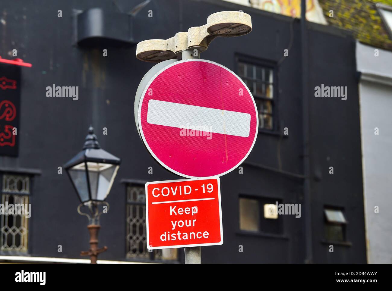 Brighton UK 20th December 2020 - Signs reminding Christmas shoppers in Brighton to keep their distance by on the day after parts of the South East were put into Tier 4 coronavirus COVID-19 restriction measures . The city of Brighton and Hove has remained in Tier 2 : Credit Simon Dack / Alamy Live News Stock Photo