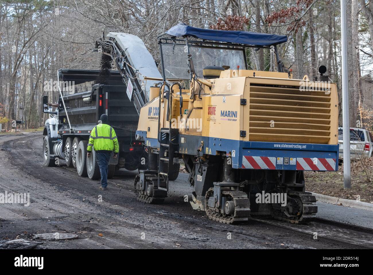 Asphalt pavement milling operation in advance of repaving Stock Photo