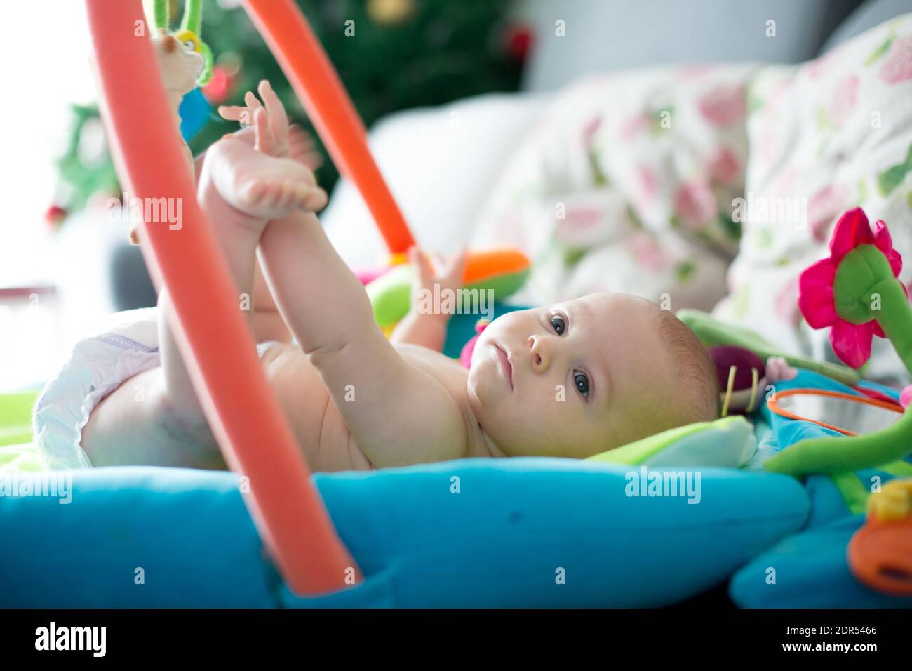 Little baby boy, playing with colorful toys at home, newborn baby ...