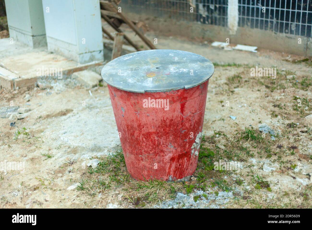 Cement bucket. Large capacity for building materials. Red bucket with a