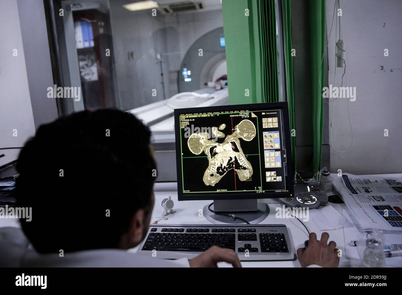 Sanaa, Yemen. 20th Dec, 2020. A medical staff member watches a screen