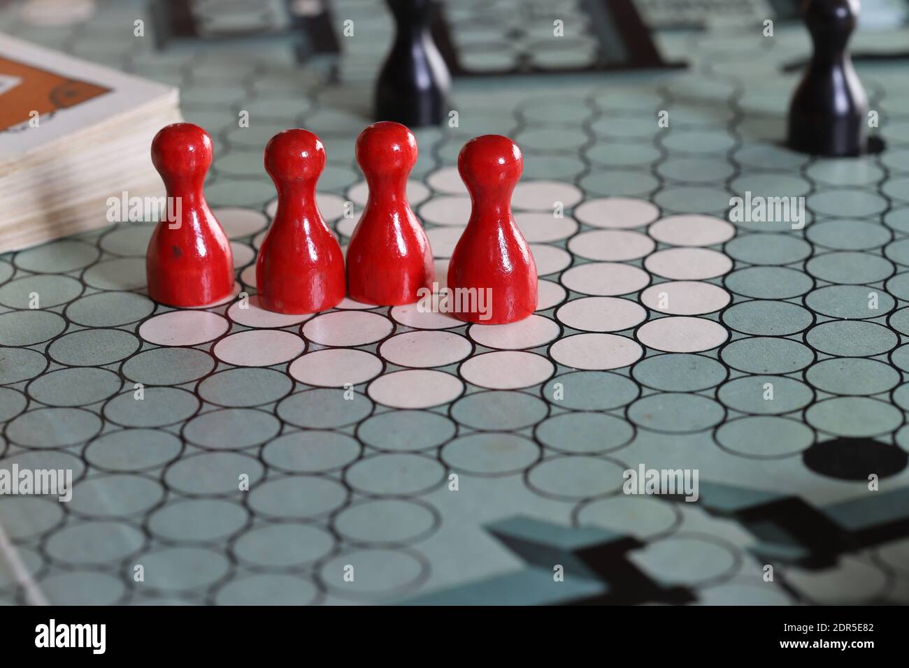 UK Escape from Colditz board game from the 1970s. Red and black playing pieces Stock Photo Alamy
