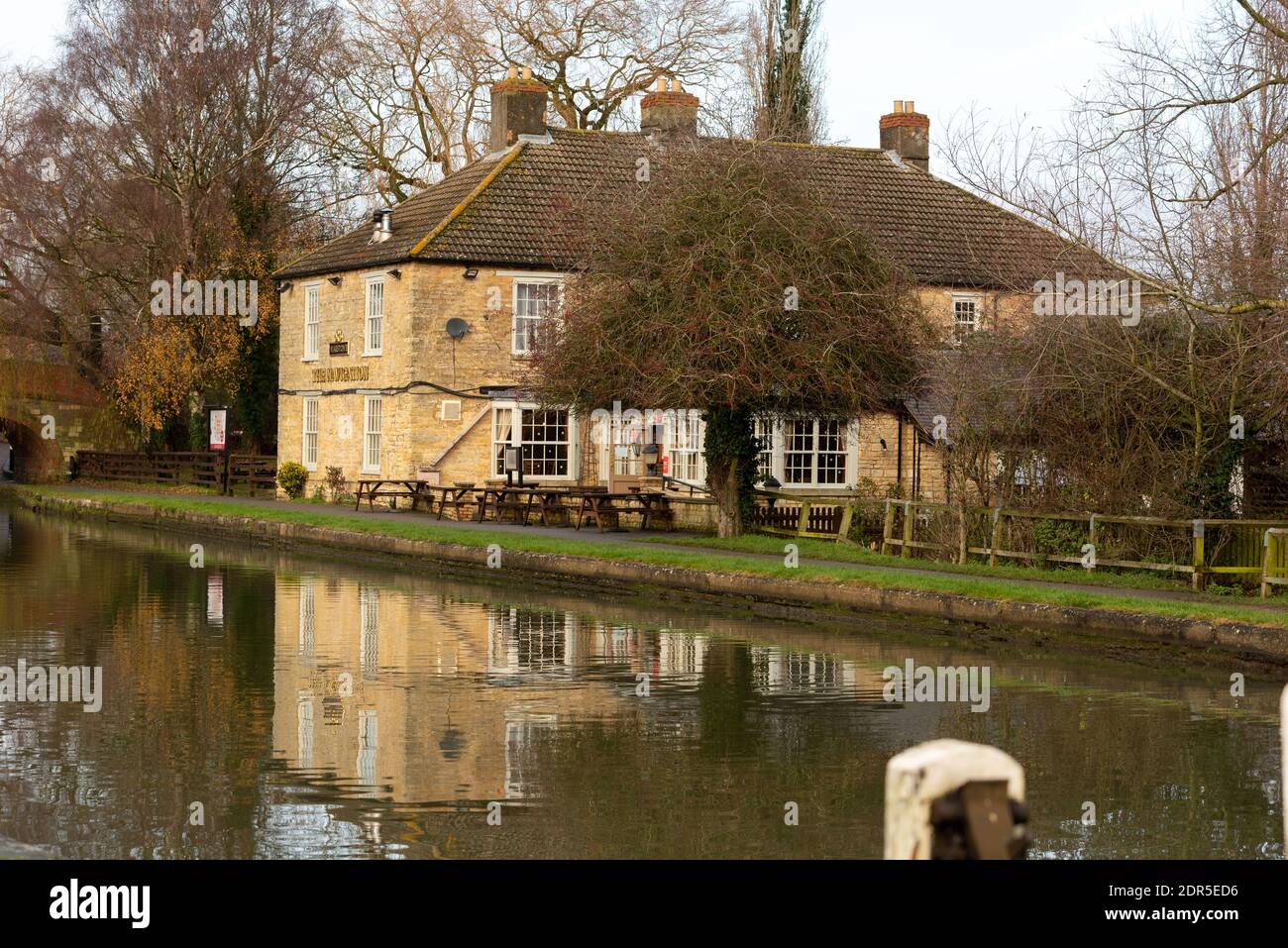 pub in uk Northampton along canal with reflection in water Stock Photo
