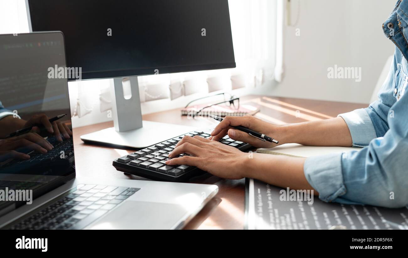 Software developer or programmer working data debugging improvement binary algorithm on desktop pc in a software develop company office Stock Photo