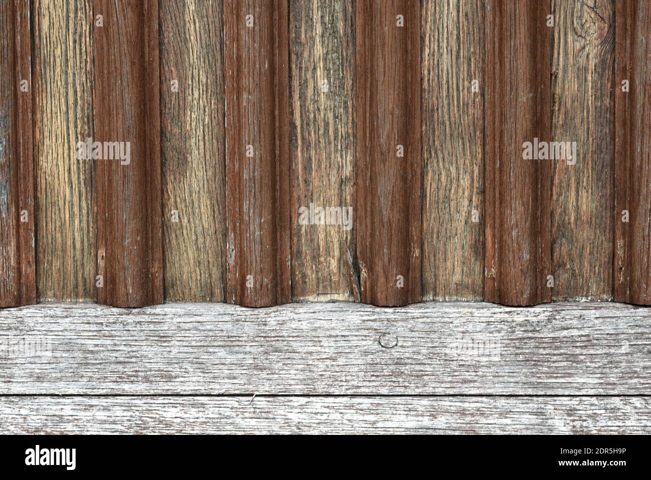 Close-up of old wooden door background with vertical and horizontal lines Stock Photo