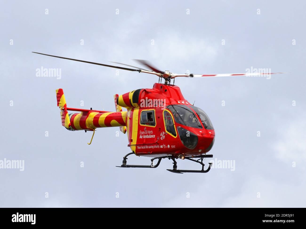 Essex and Herts air ambulance landing in a field for and emergency rescue after an accident Stock Photo