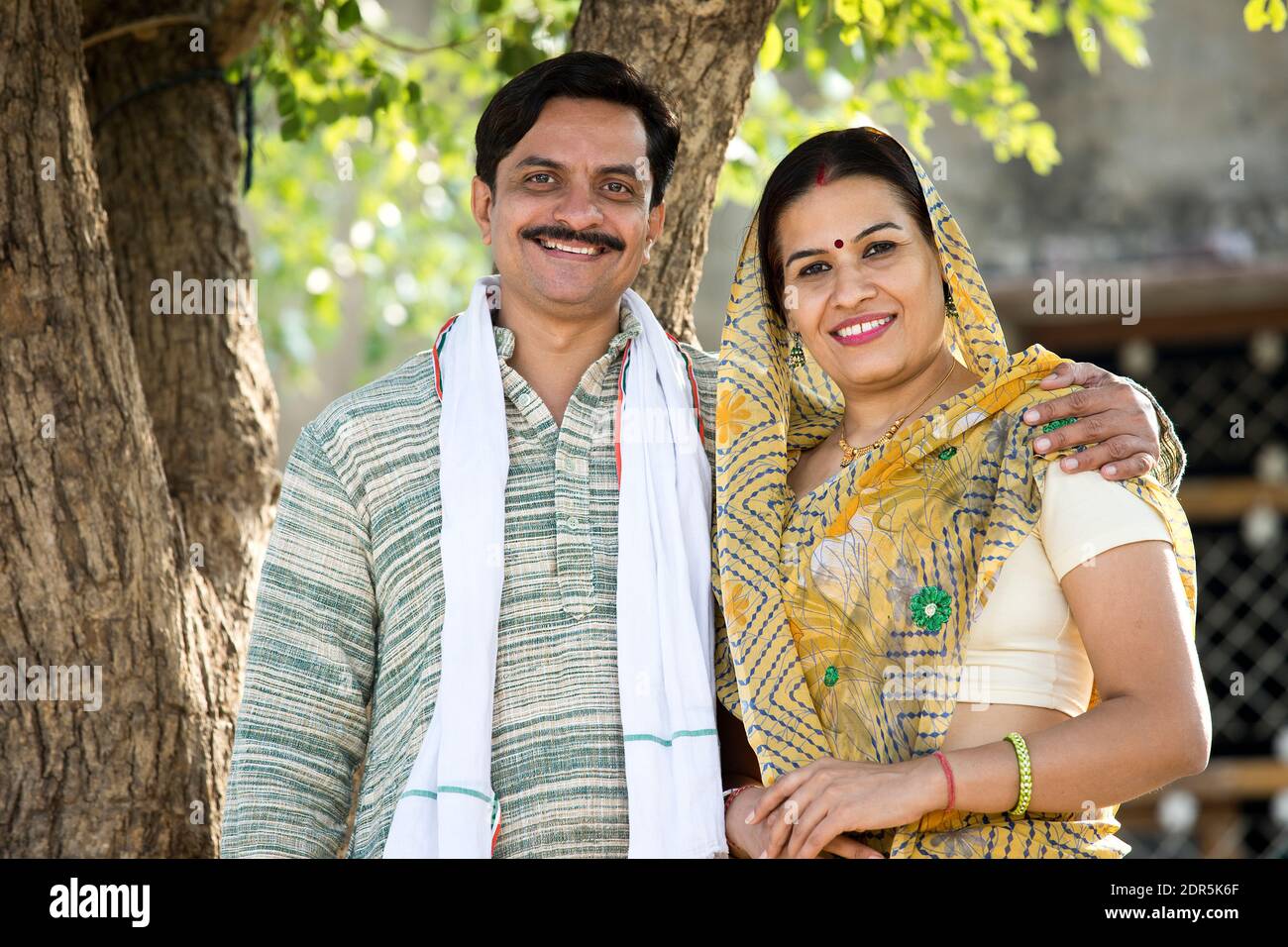 Happy rural Indian farmer with his wife at village Stock Photo